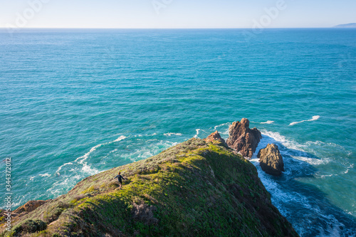 A Girl Hiking and Exploring Coastal Cliffs and Waves in Big Sur, California