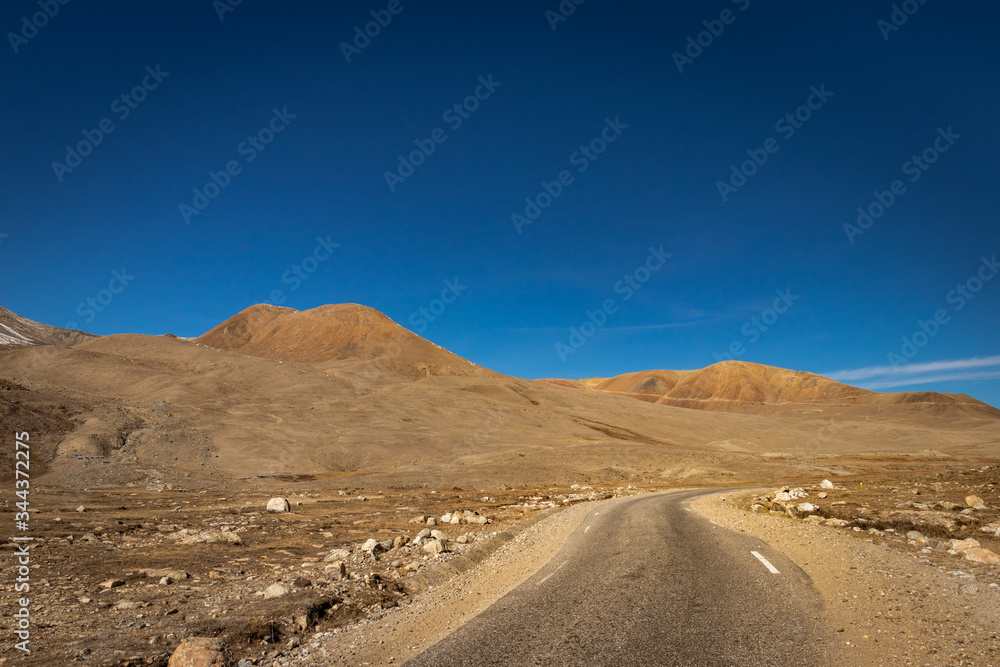 isolated picturesque tarmac road in himalaya mountain
