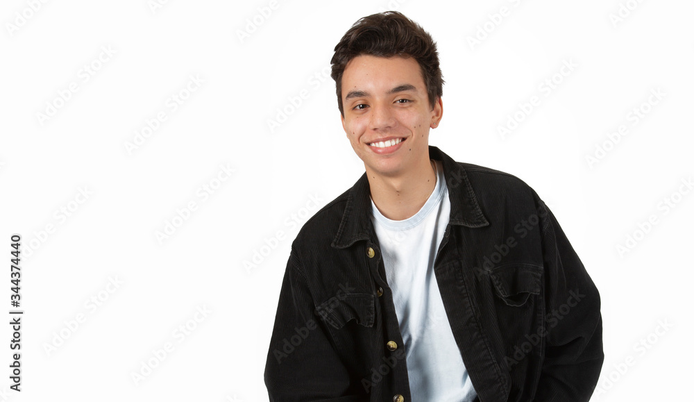 Young Attractive Smiling Male Model in Studio Against a White Backdrop Young Attractive Smiling Male Model in Studio Against a White Backdrop