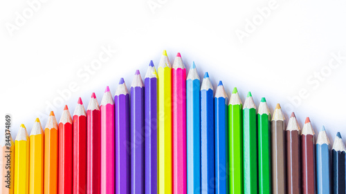 Color pencils on white background. Close up. multicolor for artist's painting, children's lesson, student's learning.