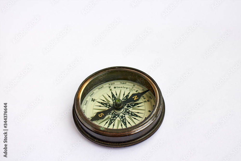 copper compass on white background copper compass on white background
