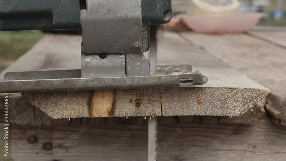 Electric jigsaw. Cut the edge of the board. Work with a tree. Joinery Electric jigsaw. Cut the edge of the board. Work with a tree. Joinery
