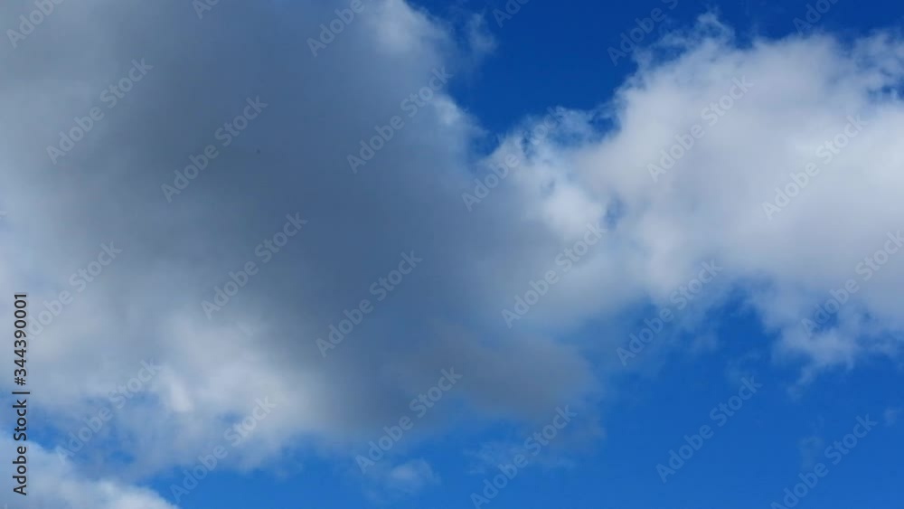 Timelapse of the sky with white running clouds passing from dark to stormy. Timelapse of the sky with white running clouds passing from dark to stormy.