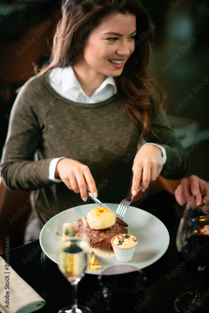 Happy loving couple enjoying in restaurant. Young couple enjoying in food. Happy loving couple enjoying in restaurant. Young couple enjoying in food.