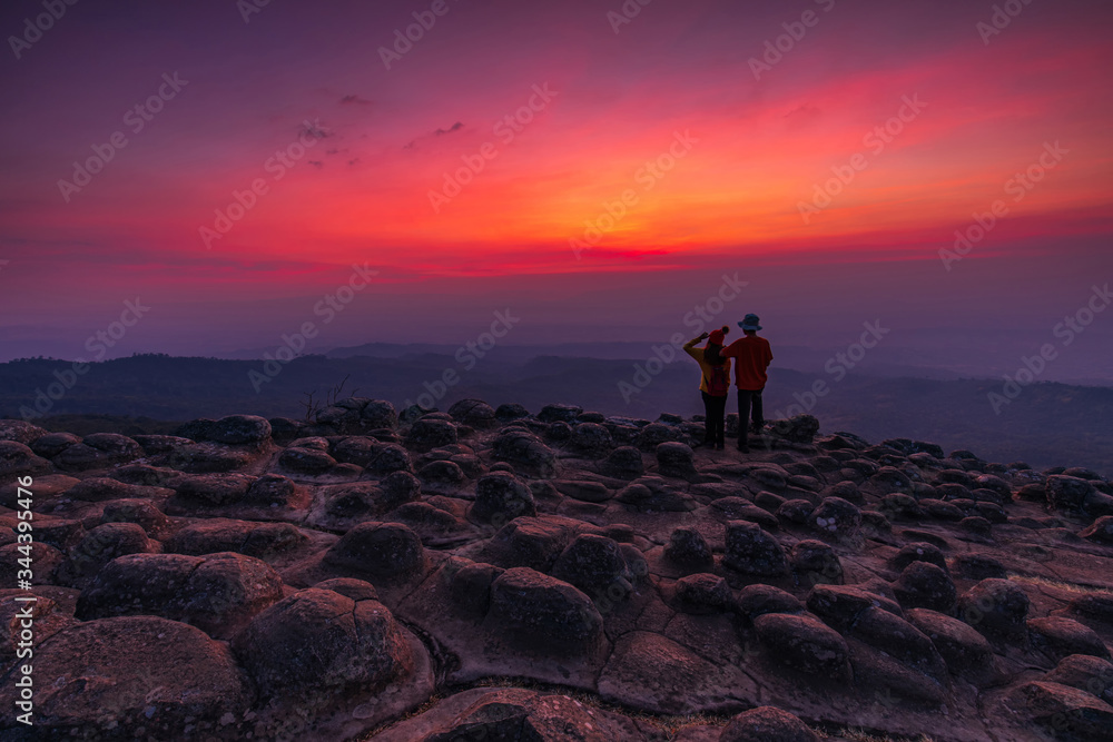 The lovers hiking on mountains. Lan-hin-pum, Phu Hin Rong Kla National park, Phitsanulok province , Thailand. The lovers hiking on mountains. Lan-hin-pum, Phu Hin Rong Kla National park, Phitsanulok province , Thailand.