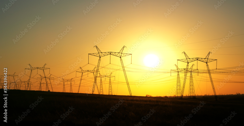 High voltage electric tower silhouette on sunset time. sunset sky ...