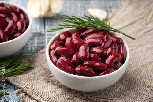 Canned red kidney beans in white bowl on a table