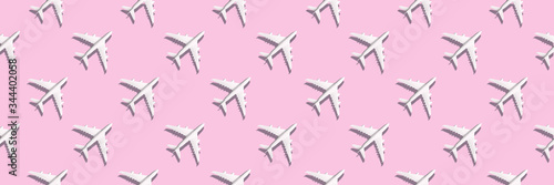 Creative banner of white planes on pink background. Travel  vacation concept. Travel  vacation ban. Flights cancelled and resumed again. Top view. Flat lay. Minimal style design. Summer pattern.