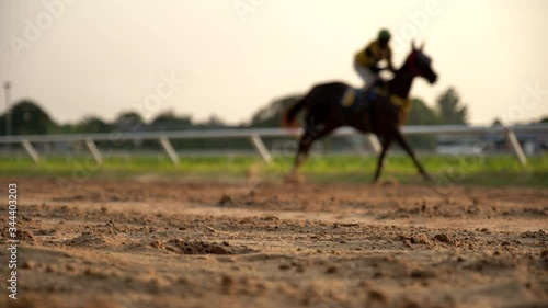 Video slow motion of horse racing at the racetrack, Group of jockey compete in horse races in slow motion, Horse riding competition in slow motion photo