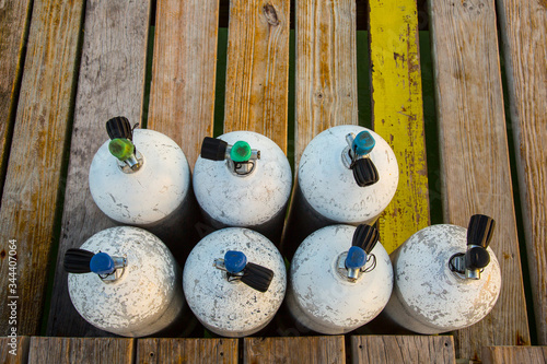 Scuba Tanks on wood dock ready for divers