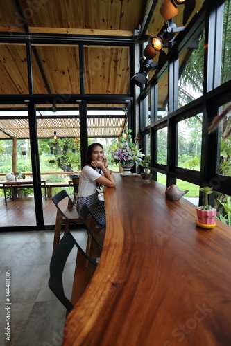 Woman sitting in a cafe in Chon Buri, Thailand