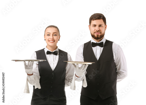Male and female waiters on ...