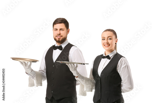 Male and female waiters on ...