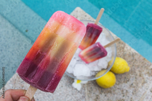 colorful popsicle ice cream popsicle in a bowl of ice