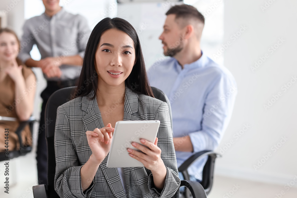 Asian businesswoman during meeting in office Asian businesswoman during meeting in office