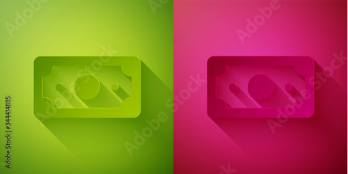 Paper cut Stacks paper money cash icon isolated on green and pink background. Money banknotes stacks. Bill currency. Paper art style. Vector Illustration