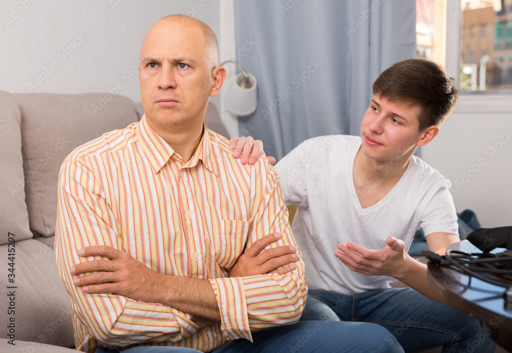 Fototapeta premium Son apologizing to father