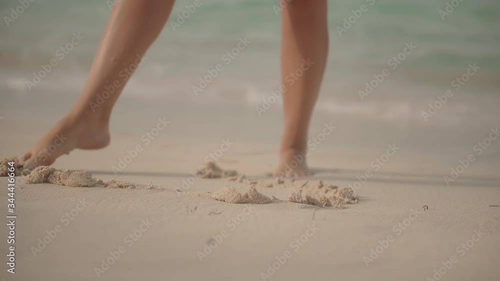 Barefoot Girl.Drawing A Heart Shape In The Sand.Woman Making Heart Shape With Tanned Legs.Fingers Made Love Sign.Legs Draws Heart In Sand.Sunbathing Enjoy Vacation On Ocean Trip. Barefoot Girl.Drawing A Heart Shape In The Sand.Woman Making Heart Shape With Tanned Legs.Fingers Made Love Sign.Legs Draws Heart In Sand.Sunbathing Enjoy Vacation On Ocean Trip.