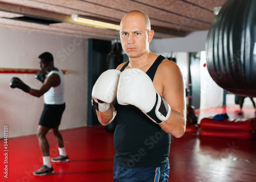 Training of muscular boxers in the gym © JackF