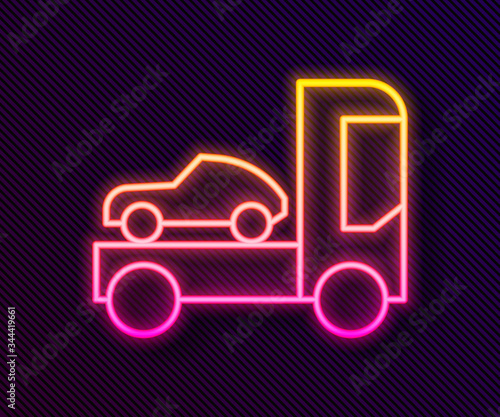 Glowing neon line Car transporter truck for transportation of car icon isolated on black background. Vector Illustration