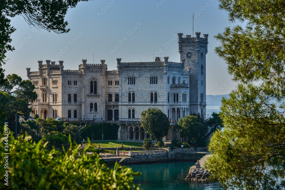 The Miramare Castle in Trieste, a nineteenth-century castle of white stone perched above the Adriatic sea. Italy