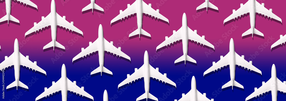 Summer pattern. Creative banner of white planes on blue, pink background. Travel, vacation concept. Travel, vacation ban. Flights cancelled and resumed again. Top view. Flat lay. Minimal style design. Summer pattern. Creative banner of white planes on blue, pink background. Travel, vacation concept. Travel, vacation ban. Flights cancelled and resumed again. Top view. Flat lay. Minimal style design.