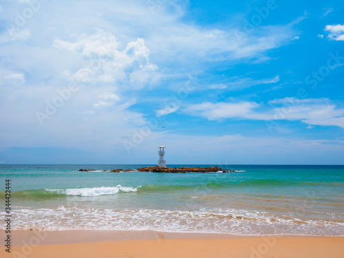 Uninhabited tropical beach with blue sky photo