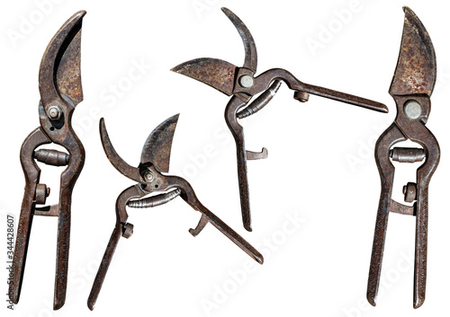 Close-up of an old rusty pruning shears isolated on white background, open and closed