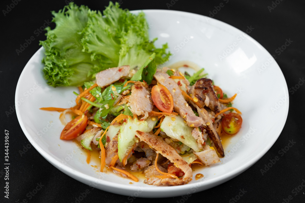 Spicy Sliced Beef Salad, Thai style - black background.