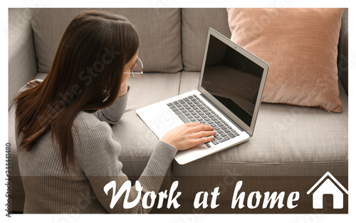 Young woman with laptop wor...