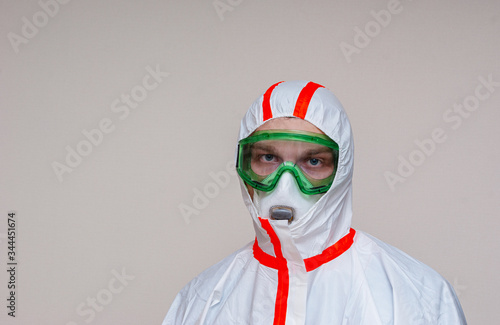 A medical scientist or a police officer in riot gear pointing to an empty space. The concept of health and crime