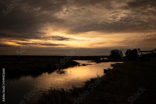 sunset over the river © Adam