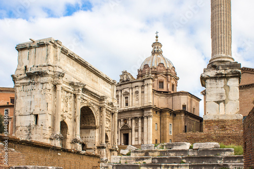 The Arch of Septimius Severus (in italian Arco di Settimo Severo) and Santi Luca e Martina Roma © pixs:sell