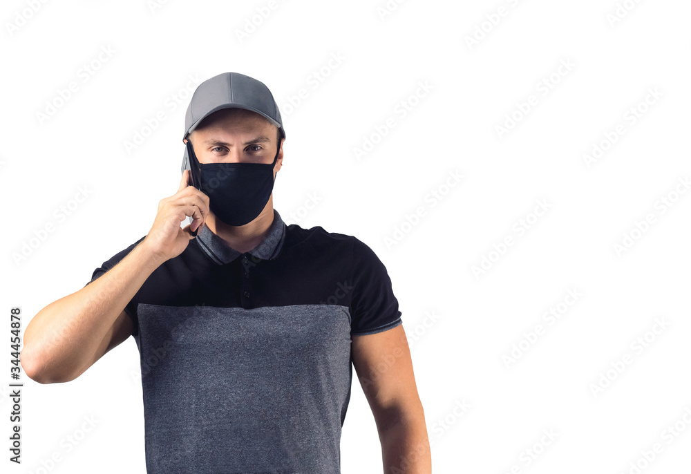 Delivery man with a phone. Man in mask against coronavirus on white background