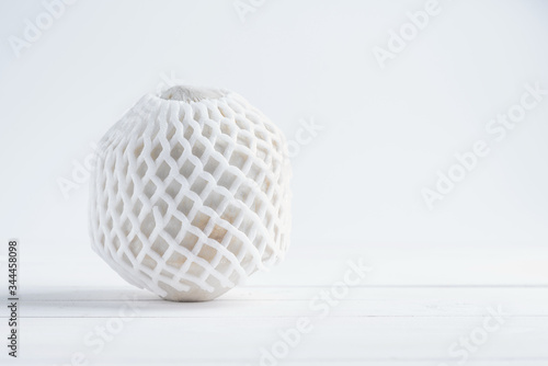 Tropical drinking coconut on white wood background.