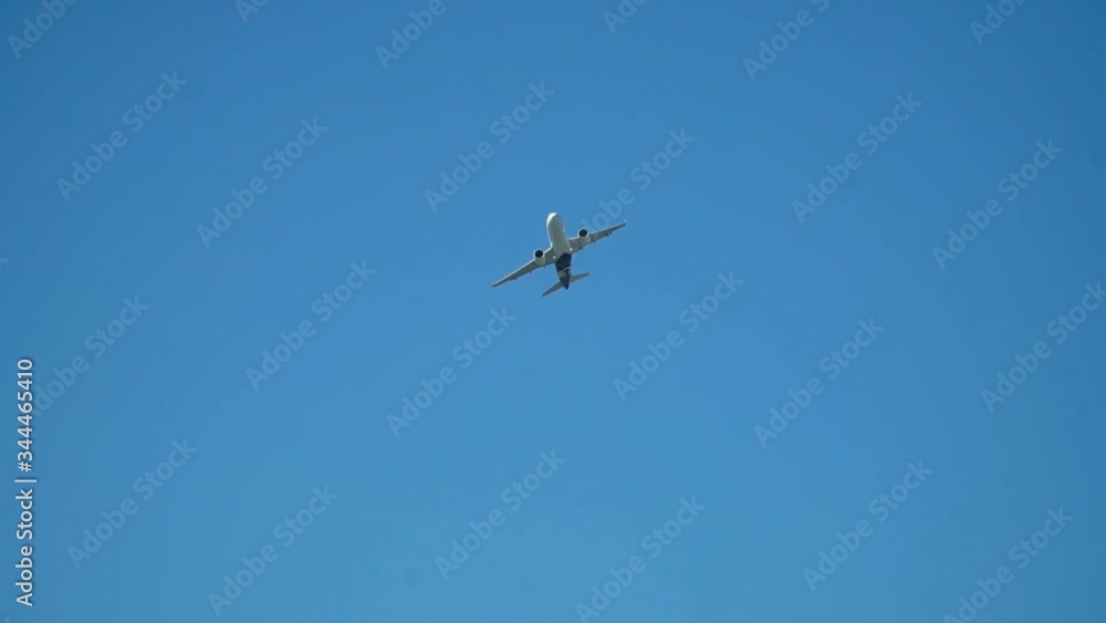 Large plane take off day. A large passenger airliner is taking of during a beautful sunny day. Slow motion close up. Large plane take off day. A large passenger airliner is taking of during a beautful sunny day. Slow motion close up.