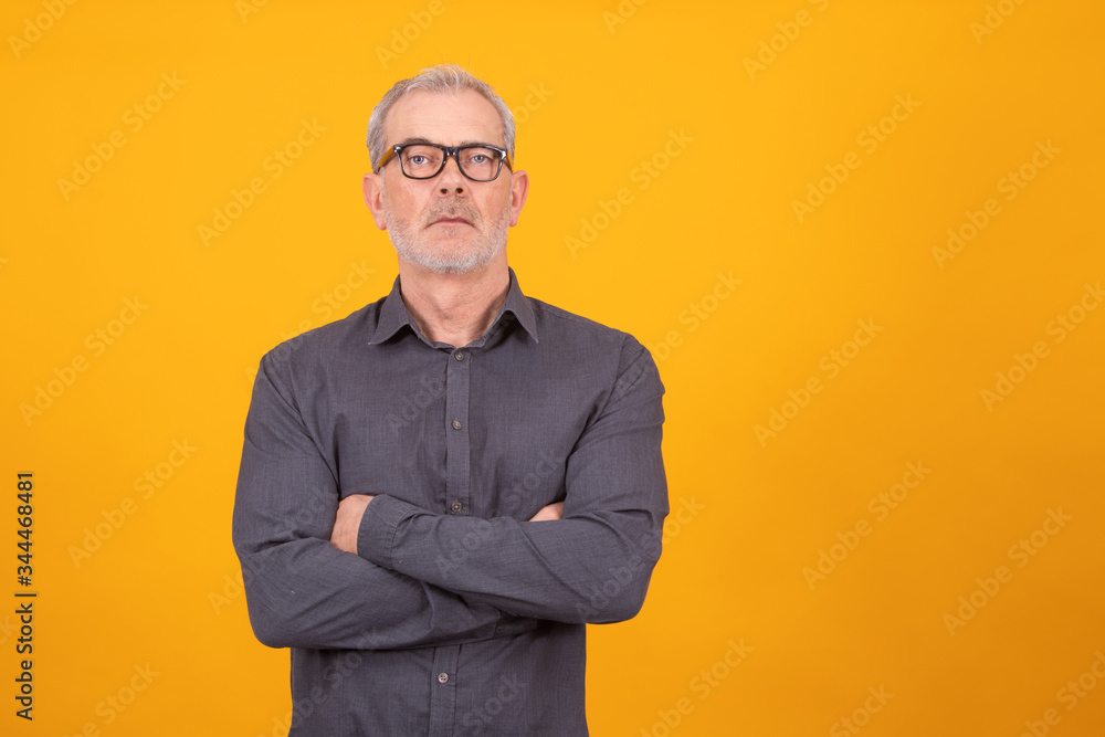 adult or senior man with glasses isolated on color background adult or senior man with glasses isolated on color background