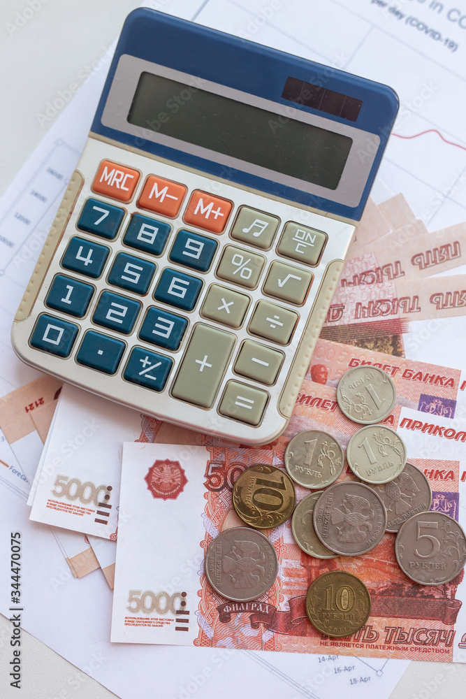Banknotes of Russia and calculator. World economic crisis Banknotes of Russia and calculator. World economic crisis