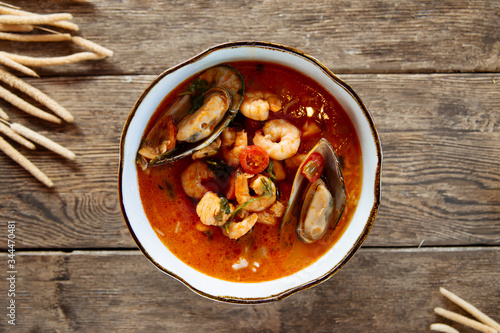 Top view on asian thai tom yam seafood soup