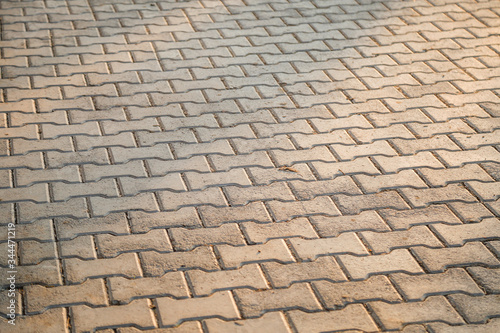 Perspective View Monotone Gray Brick Stone Pavement on The Ground for Street Road. Sidewalk, Driveway, Pavers, Pavement in Vintage Design Ground Flooring Square Pattern Texture Background for mock up