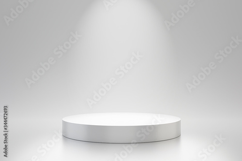 White studio template and round shape pedestal on simple background with spotlight product shelf. Blank studio podium for advertising. 3D rendering. photo