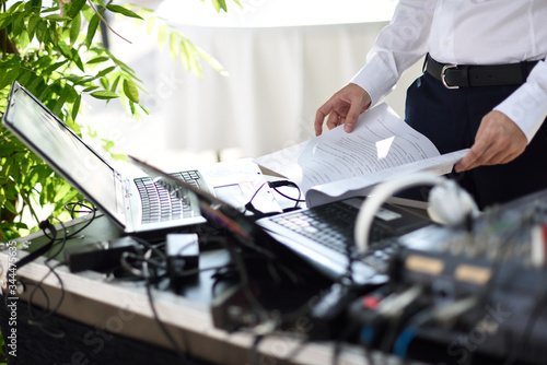 DJ table with laptop and wedding texts.