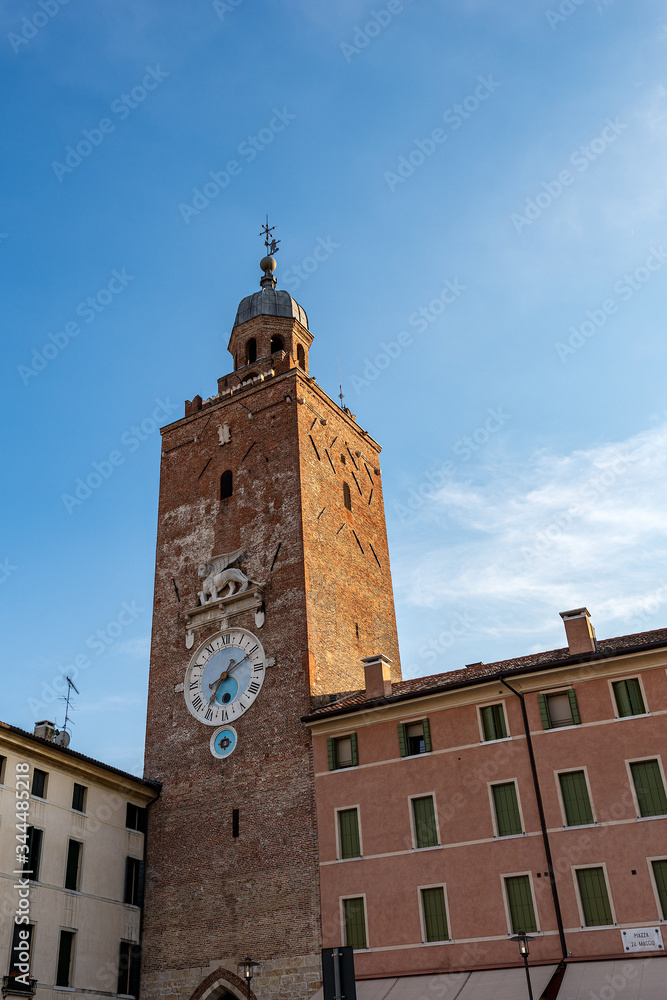 Torre Civica, Ancient civic tower with clock and the marble winged lion of St Mark, symbol of the evangelist and the Venetian Republic. Castelfranco Veneto, Treviso, Veneto, Italy, Europe