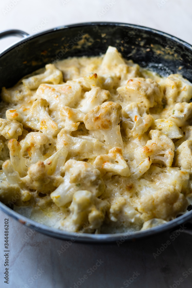 Roasted Cauliflower with Cream, Milk and Cheddar Cheese in Pan Pot / Healthy Organic Vegetarian Food. Roasted Cauliflower with Cream, Milk and Cheddar Cheese in Pan Pot / Healthy Organic Vegetarian Food.