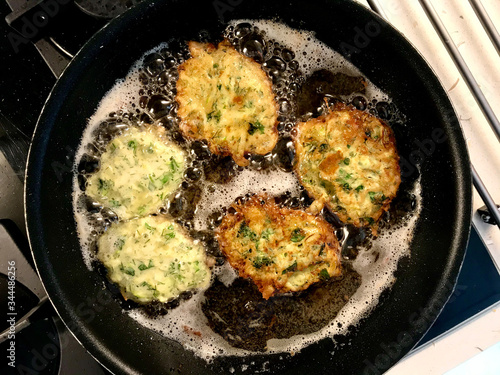 Cooking and Frying Zucchini Fries in Pan called Turkish Mucver.