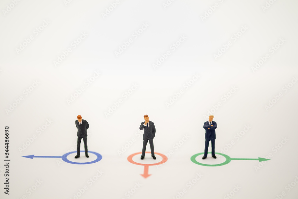 Businessman miniature people figure thinking in circle direction forward on white background with copy space using for business,marketing and financial concept.
