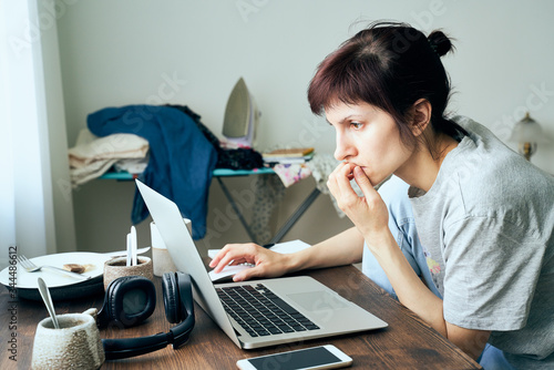 Photography Digital addiction, woman in panic reads articles about coronavirus on Internet,