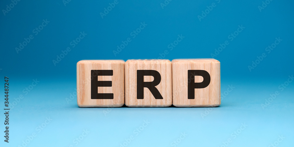 ERP crm concept on wooden cubes on a blue gradient background ERP crm concept on wooden cubes on a blue gradient background