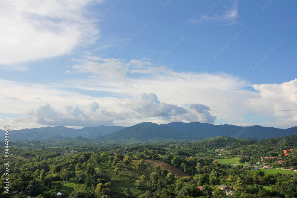 View of green vegetation and mountains from above the Big Buddha of Chiang Rai