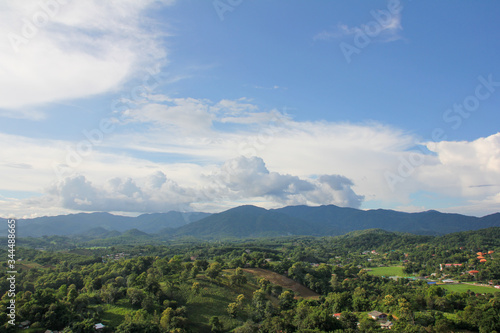 View of green vegetation and mountains from above the Big Buddha of Chiang Rai